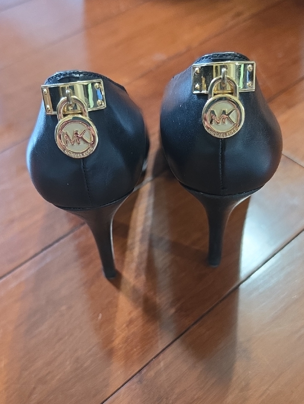 Michael Kors Black Leather High Heel Pumps with Gold MK Charms